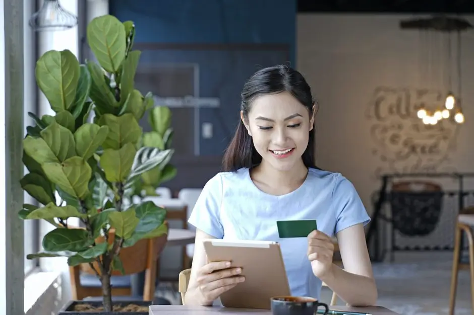 Asian woman holding a membership card